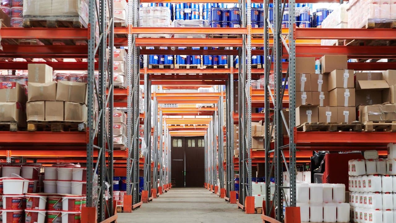 Operations team discussing logistics in a warehouse setting